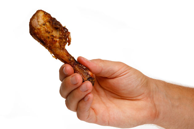 午餐一块烤鸡肉在手上隔离在白色家禽手臂美味