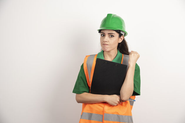 主管成功的女建造师戴头盔和安全橙色背心的肖像高质量的照片工人工程师职业