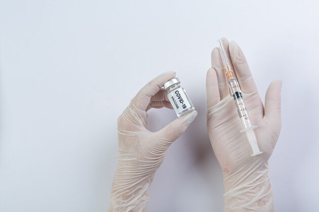 流行病把科学家或医生手里的一小瓶疫苗合上诊断诊断面罩