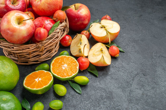食物侧面特写查看不同水果旁边篮子里的水果苹果特写篮子