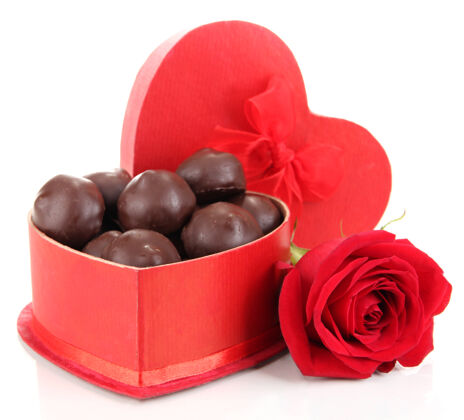 小吃巧克力糖果在礼品盒里 白色的蝴蝶结情人节糕点