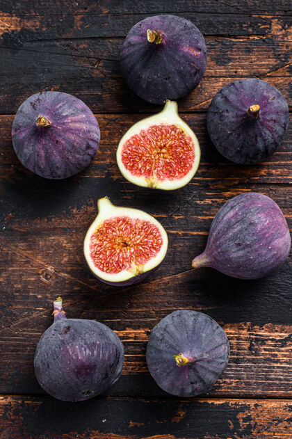 水果木头上的紫色无花果桌子深色木制的桌面查看营养食品切片