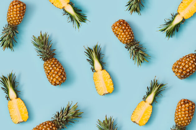 Ananas彩色图案的菠萝粉蓝色表面饮食切片维生素