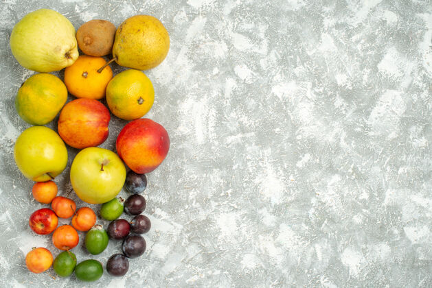 食物顶视图不同的水果组成新鲜水果的白色背景树维生素新鲜水果颜色成熟饮食葡萄苹果