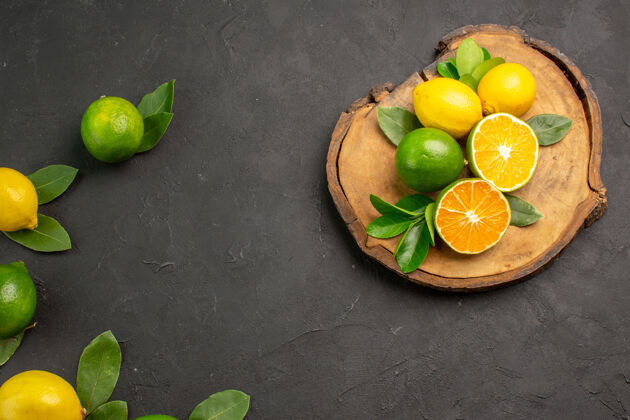 健康顶视图新鲜的酸柠檬上一个深灰色的表水果柑橘酸橙食物柑橘酸橙