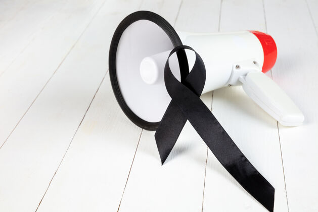 徽章黑丝带象征着对抗黑色素瘤和皮肤癌反对控制癌症