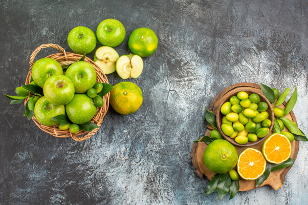 可食用水果从远处俯瞰苹果板上摆满柑橘类水果的苹果篮饮食多汁柠檬