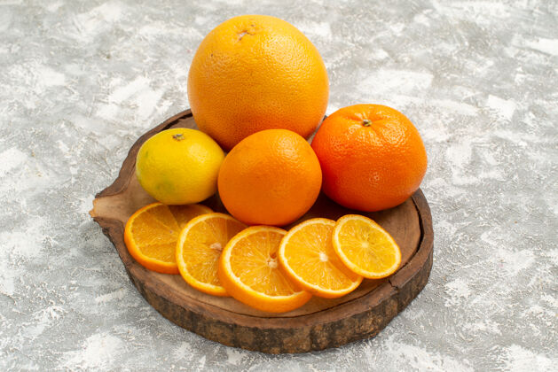 减肥前视图新鲜的橘子和橘子在白色背景上柑橘异国情调的热带新鲜水果视野健的