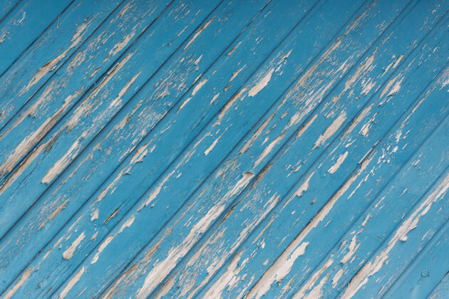 面板特写镜头的一个老缺口蓝色木制表面木材裂纹年龄