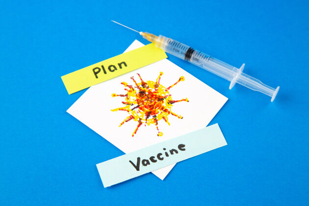 健康前视图杀毒注射与covid图纸上的蓝色背景药物蓝色医院