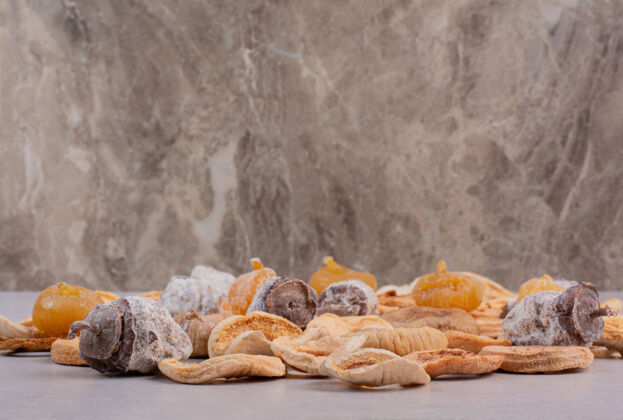 橙子混合健康干果与大理石背景高品质的照片苹果健康大理石