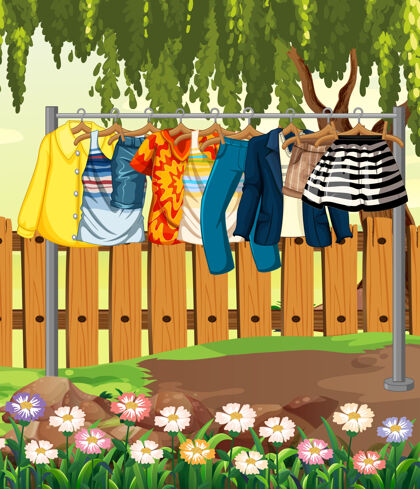 洗涤挂在晾衣绳上的衣服 花园里有篱笆和鲜花温暖场景绳索