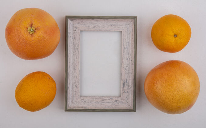 空间顶视图复制空间葡萄柚和灰色背景上的灰色框架橙色橙色葡萄柚水果