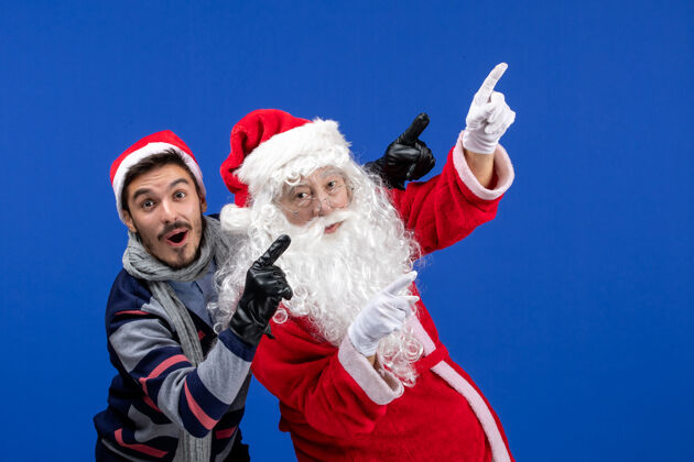 圣诞老人前视图圣诞老人和年轻的男性季节性礼物圣诞老人